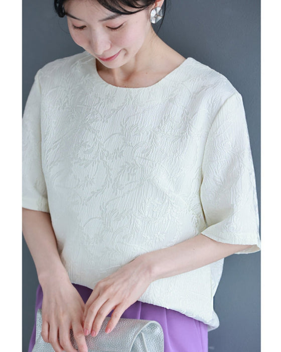 Pullover top with floating leaf pattern and relief effect