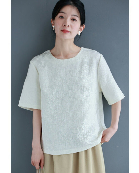Pullover top with floating leaf pattern and relief effect