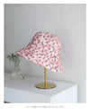 A gorgeous pink floral hat made of UV-cut material that can withstand the sun.