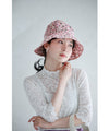 A gorgeous pink floral hat made of UV-cut material that can withstand the sun.