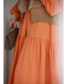 A plain yet gorgeous tiered long dress