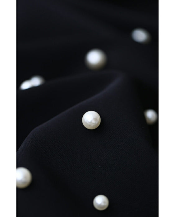 裾に艶めくパールビジューのテーパードパンツ