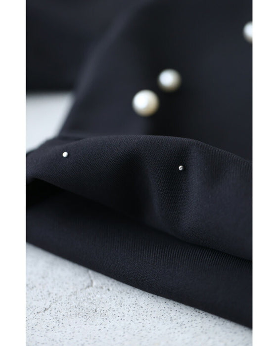 裾に艶めくパールビジューのテーパードパンツ