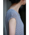 A mid-length dress with a voluminous skirt and waistline