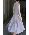 A mid-length dress with a voluminous skirt and waistline