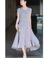 A mid-length dress with a voluminous skirt and waistline
