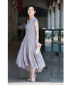 A mid-length dress with a voluminous skirt and waistline