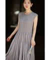 A mid-length dress with a voluminous skirt and waistline