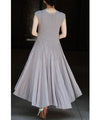 A mid-length dress with a voluminous skirt and waistline