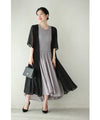 A mid-length dress with a voluminous skirt and waistline