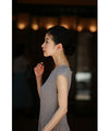 A mid-length dress with a voluminous skirt and waistline