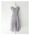 A mid-length dress with a voluminous skirt and waistline