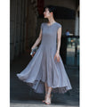 A mid-length dress with a voluminous skirt and waistline