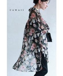  Airy tunic with graceful flowers spread across a sheer canvas