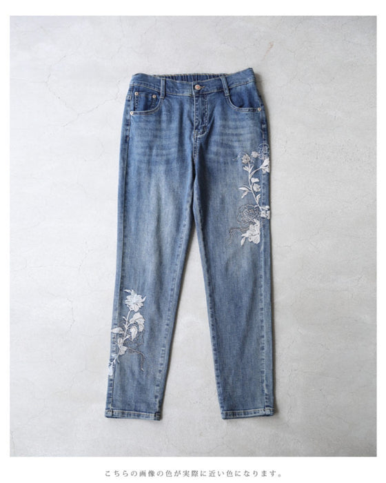Denim pants with rhinestones and embroidered flowers