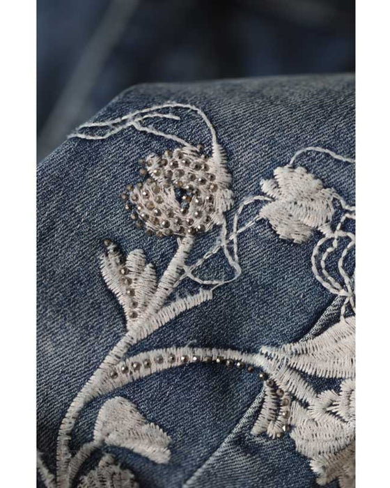 Denim pants with rhinestones and embroidered flowers