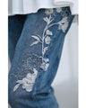 Denim pants with rhinestones and embroidered flowers