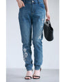 Denim pants with rhinestones and embroidered flowers