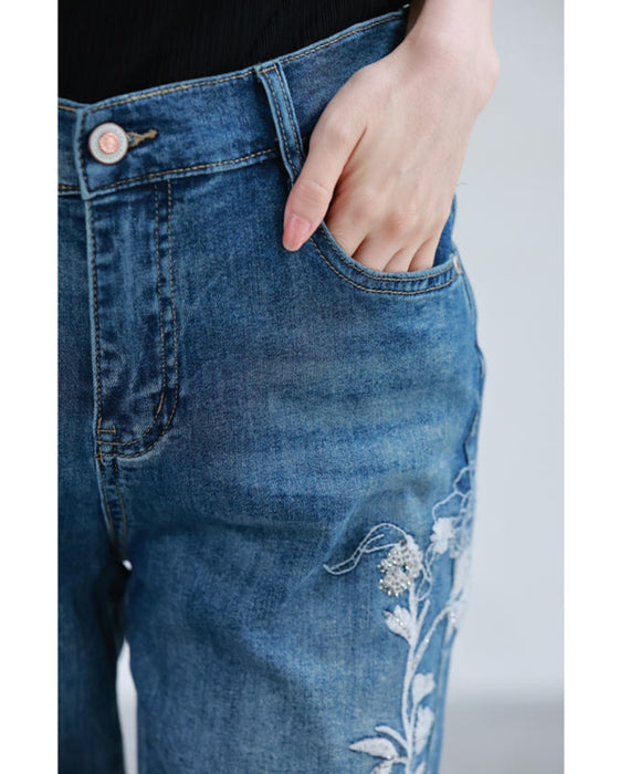 Denim pants with rhinestones and embroidered flowers