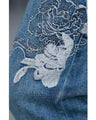 Denim pants with rhinestones and embroidered flowers