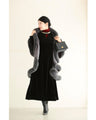 A medium-length velour-like dress with a pearl neck that wraps around you