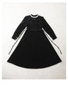 A medium-length velour-like dress with a pearl neck that wraps around you
