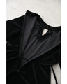 A medium-length velour-like dress with a pearl neck that wraps around you