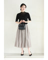 A streamlined ribbed cut-and-sew top with light particles falling on it