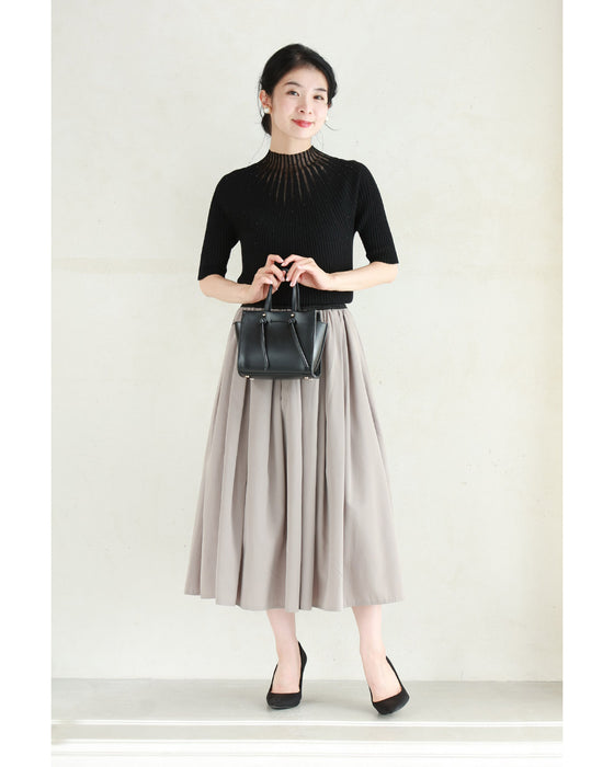 光の粒が降り注ぐ流線ラインリブカットソートップス