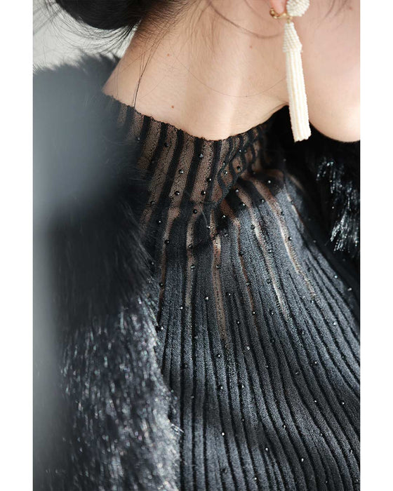 光の粒が降り注ぐ流線ラインリブカットソートップス