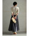 A streamlined ribbed cut-and-sew top with light particles falling on it