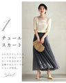 A streamlined ribbed cut-and-sew top with light particles falling on it