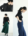 A streamlined ribbed cut-and-sew top with light particles falling on it