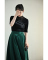A streamlined ribbed cut-and-sew top with light particles falling on it