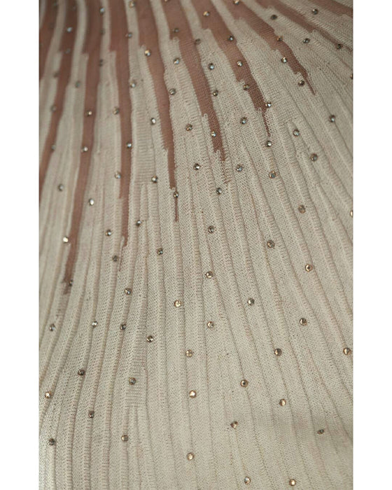 A streamlined ribbed cut-and-sew top with light particles falling on it