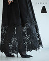 A long dress with lace that spreads out at the feet