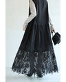 A long dress with lace that spreads out at the feet