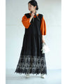 A long dress with lace that spreads out at the feet