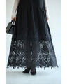 A long dress with lace that spreads out at the feet