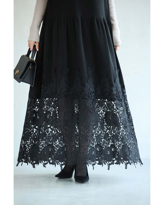 A long dress with lace that spreads out at the feet