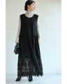 A long dress with lace that spreads out at the feet