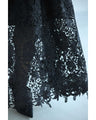 A long dress with lace that spreads out at the feet