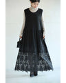 A long dress with lace that spreads out at the feet