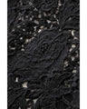 A long dress with lace that spreads out at the feet