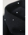 A thin cut-and-sew top with draping and sparkling rhinestones