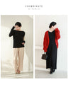 A thin cut-and-sew top with draping and sparkling rhinestones