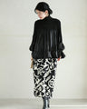 Flared blouse top with fluttery circle frills