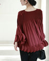Flared blouse top with fluttery circle frills
