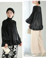 Flared blouse top with fluttery circle frills