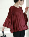 Flared blouse top with fluttery circle frills